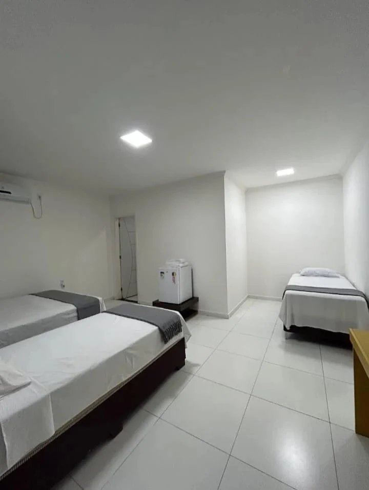 Acomodação com três camas